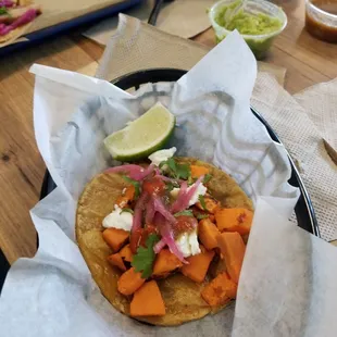 Sweet potato taco. Great mix of flavors with the sweet potato, goat cheese, cilantro, pickled onions, and chili morita!