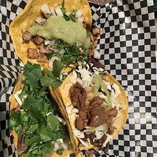 two tacos on checkered paper