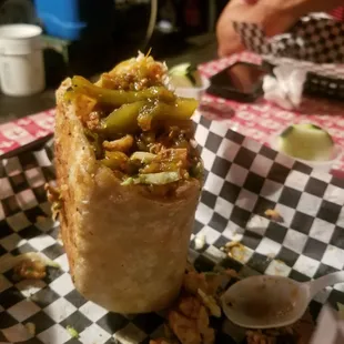 a taco burrito on a checkered plate