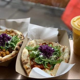 two tacos and a drink on a table