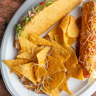 a taco and chips on a plate