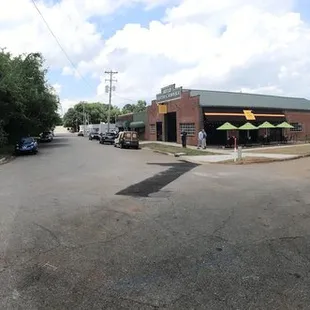 Street view/front of Taco Mama showing street parking and Patio area