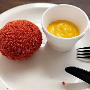 Birria cheese balls dusted with hot Cheetos