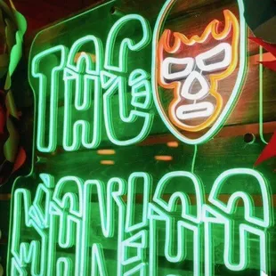 a neon sign for a mexican restaurant