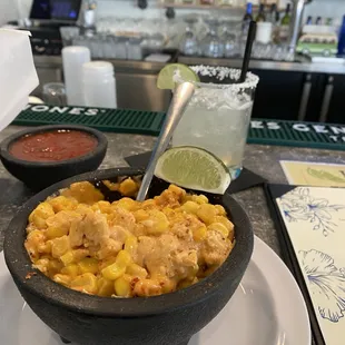 Mexican Street Corn: corn grain prepared with chipotle based salsa, Cotija, and Tahin