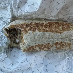 Ground beef burrito, cheese, rice, onions