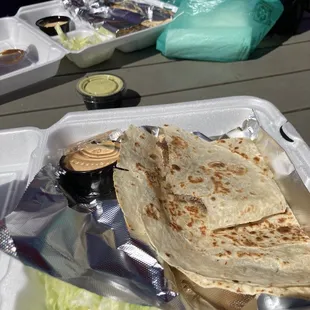 a tortilla in a styrofoam container