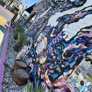 a colorful mural on the side of a building