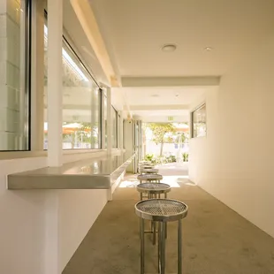 a hallway with tables and benches