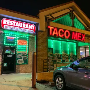 a car parked in front of a restaurant