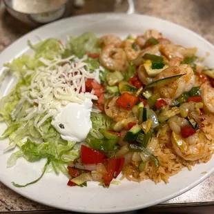 My husband ordered rice and some veggies and he got the fancy little lettuce cheese, sour cream tomato on the side