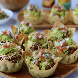 a plate of taco cups