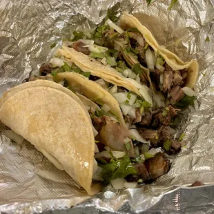 two tacos in foil