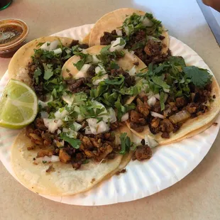 Five tacos: three de Carne Asasa and two of Al Pastor. A total of $6 plus tax.