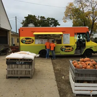 a taco truck parked in front of a house