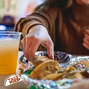 a woman eating a taco