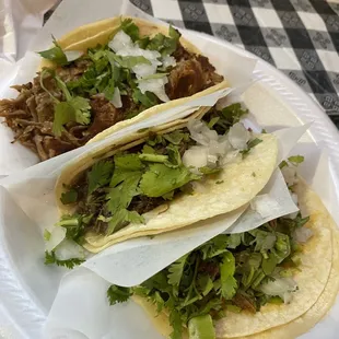 Beef, carnitas, and goat tacos