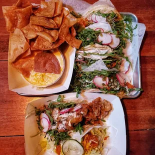 Roasted root vegetable tacos, crispy mushroom taco, crispy chicken taco, and chips and queso