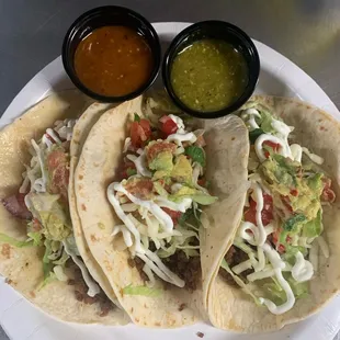 Tacos Supreme order of 3 tacos flour tortillas, with Mexican cream, lettuce, Guacamole, meat of your choice.