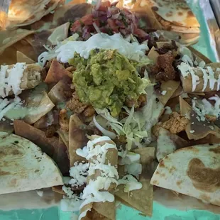 NACHOS FIESTA
with two types of meat, chicken quesadilla, and chicken flauta.