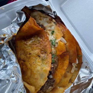 a close up of a taco in a styrofoam container