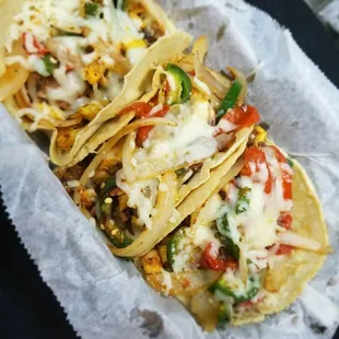 Alambre Tacos, grilled chicken and beef with tomatoes,onions,jalapeños, topped with mozzarella cheeses.