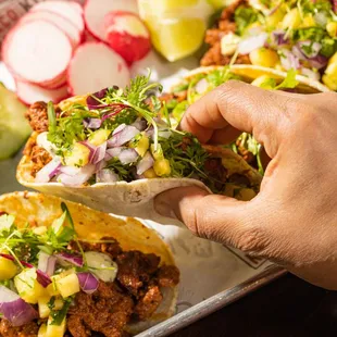 Pork al pastor all day, everyday. Grab one, or three, or nine, or more!