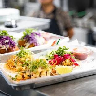Fish tacos, chicken al pastor, and brisket barbacoa. A plate of dreams!