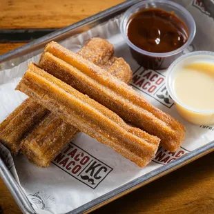 dulce de leche churros with goat milk caramel and sweet cream dip