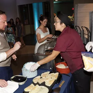 a group of people serving food