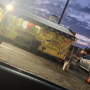a taco truck parked in a parking lot