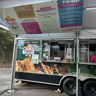 a food truck with a menu on the side