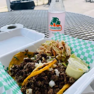 a person holding a bottle of soda