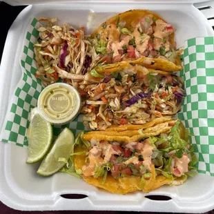 a close up of a tray of tacos