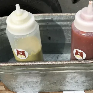 House sauces available on the side.  Spicy jalapeño creme  Mild roasted garlic