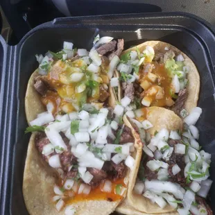Barbacoa and asada tacos (oh too much onion too strong onion)