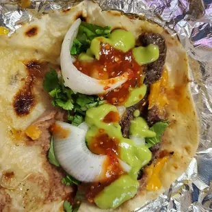 Beef pirata Jr dressed with requested (salsa bar) grilled onion, green sauce, red salsa, cilantro)