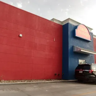 a car parked in front of a restaurant