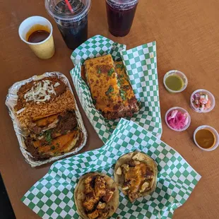 Birria tacos combo, jamaica drink, birria quesadilla, and paneer and chicken tikka tacos