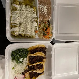 a variety of food in a styrofoam container