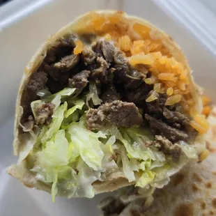 Steak burrito with no tomato or avocado and substituted rice for the beans