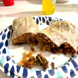 Al Pastore burrito very little meat in it mostly all beans and rice $15. What a joke.