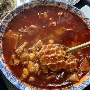 a bowl of soup with a spoon in it