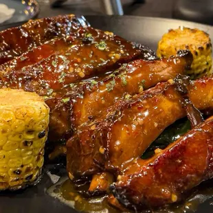 ribs and corn on a plate