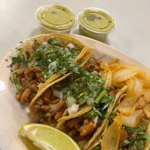 Chicken tacos with green salsa.