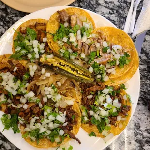 Asda, pastor, and carnitas tacos