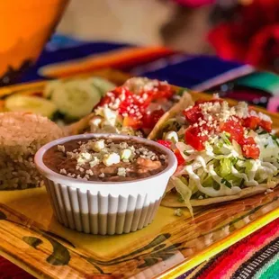 Tacos supreme combo, side of rice and beans.