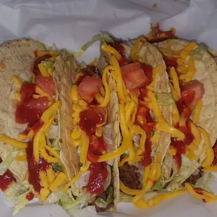 Six pack of tacos with hot sauce instead of mild.