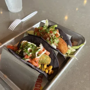 Fried Avocado taco on the left, fried oysters on the right.