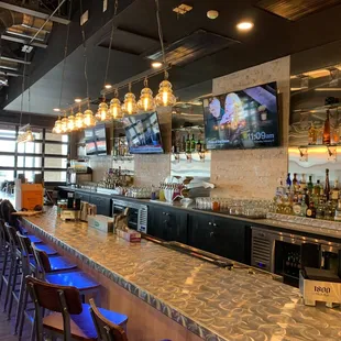 a bar with a large television